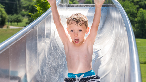 Child on water slide atlantics stainless steel slides open air swimming pool flehingen oberthedingen bathroomen wuerttemberg pool 168105