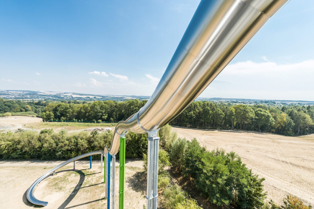 View from above of a stainless steel slide in Sonnenlandpark in Lichtenau