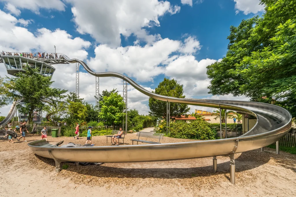 atlantics stainless steel slide in the Leisure park Irrland at the Airport Tower, tunnel half-shell slide with bobbing curve