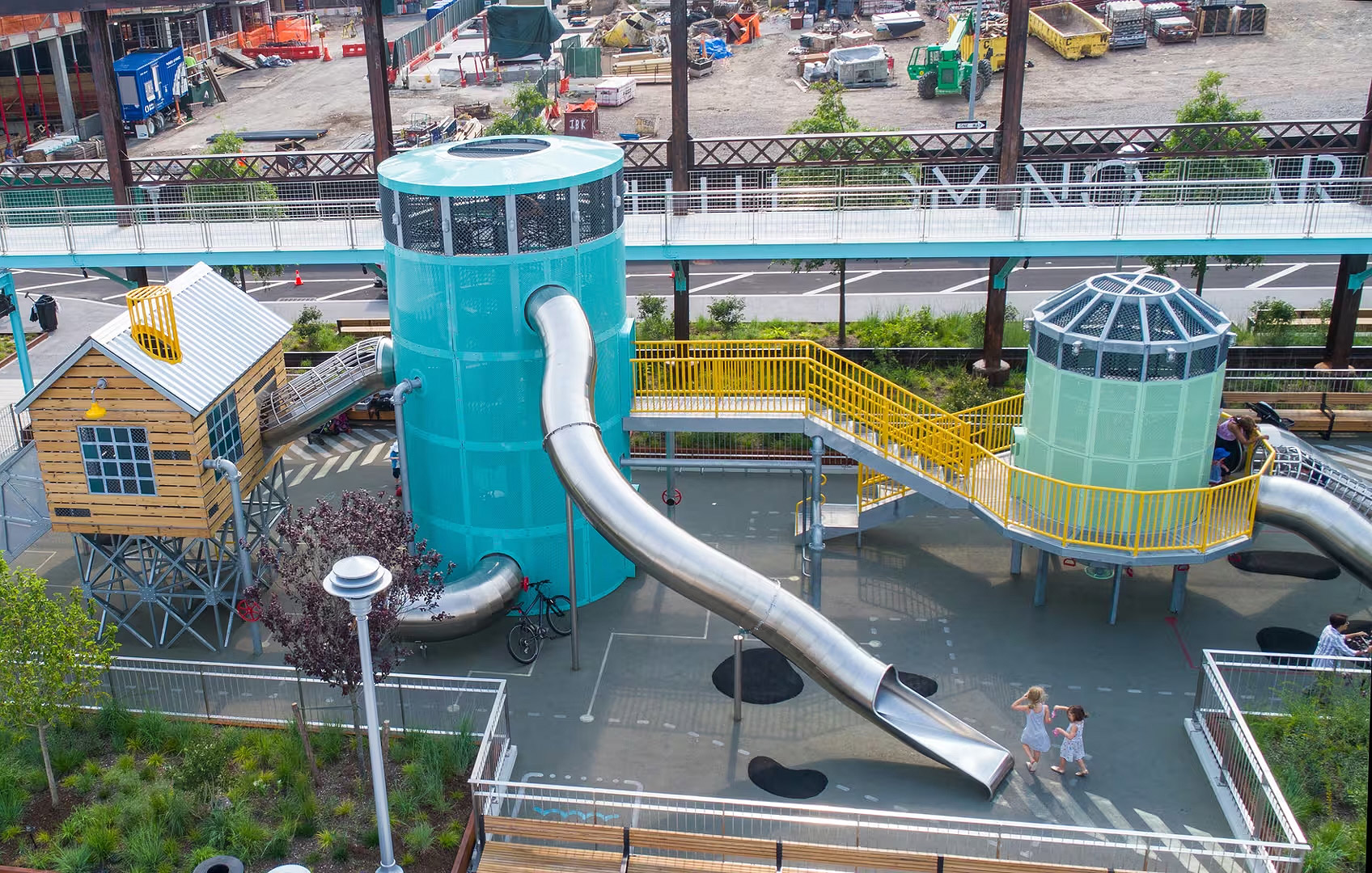 atlantics stainless steel slides on a play structure at a Playground in Brooklyn, New York City, USA